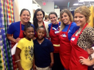 Junior League of Tulsa members Jenny Barrett, Allison Kager, Susan Lentz, Katie Spadoro, and Mary Brenneman volunteering for the Operation School Bell project at The Assistance League of Tulsa.